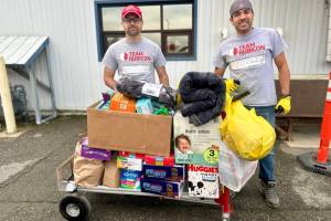 Volunteers for the Western Alaska disaster response receive one of several loads of donations from Homer area community members on Monday, Oct. 27, 2025, at the main drop-off site in Anchorage, Alaska. Photo by Christina Whiting