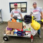 Volunteers for the Western Alaska disaster response receive one of several loads of donations from Homer area community members on Monday, Oct. 27, 2025, at the main drop-off site in Anchorage, Alaska. Photo by Christina Whiting