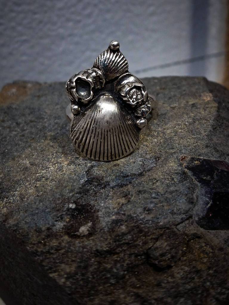 This Kachemak Bay Barnacle Ring created by artist Carley Conemac and on display through October at Homer Council on the Arts is made from real barnacles found on a local beach and preserved in silver clay, accompanied by silver clay shells. Photo provided by Carley Conemac