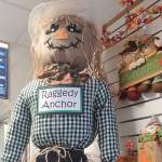A friendly scarecrow stands on the counter at the Anchor Point Post Office in October 2025 in Anchor Point, Alaska. (Delcenia Cosman/Homer News)