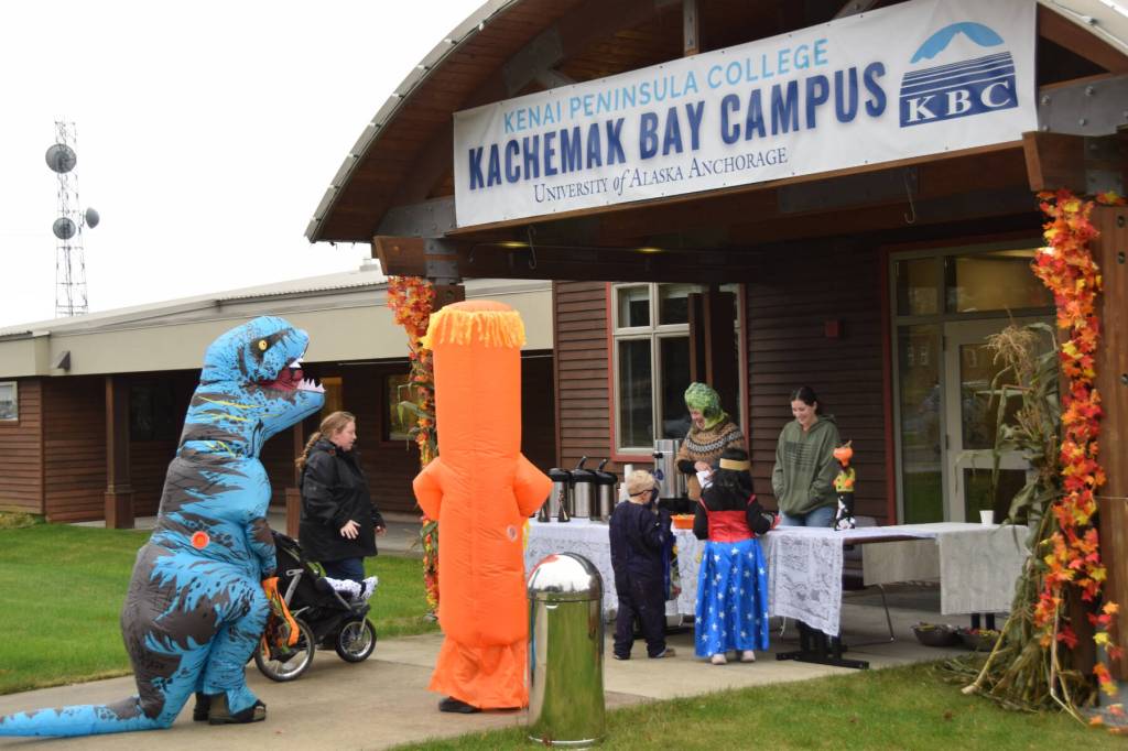 Trick-or-treaters get treats at Kachemak Bay Campus during Pioneer Avenue Trick or Treat on Friday, Oct. 31, 2025, in Homer, Alaska. (Delcenia Cosman/Homer News)