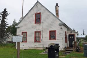 The historic marker in front of this building at 502A Overland Avenue in Kenai identifies the structure as the former headquarters of the Kenai National Wildlife Refuge and the site of the former Agricultural Experiment Station, 1899-1908. Photo by Clark Fair