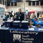 A South Peninsula Hospital employee mans the table for blood test results during the Rotary Health Fair on Saturday, Nov. 8, 2025, at Christian Community Church in Homer, Alaska. Photo provided by South Peninsula Hospital