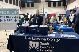 A South Peninsula Hospital employee mans the table for blood test results during the Rotary Health Fair on Saturday, Nov. 8, 2025, at Christian Community Church in Homer, Alaska. Photo provided by South Peninsula Hospital
