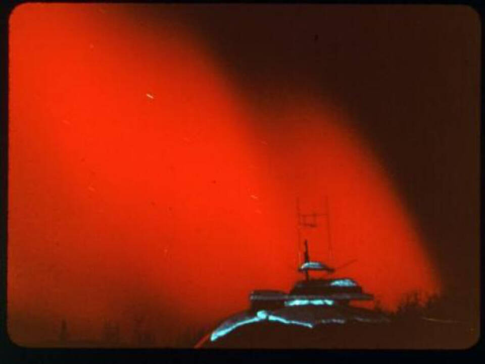 A rare red aurora is seen over Alaska in February 1958. Photo courtesy of the University of Alaska Fairbanks Geophysical Institute