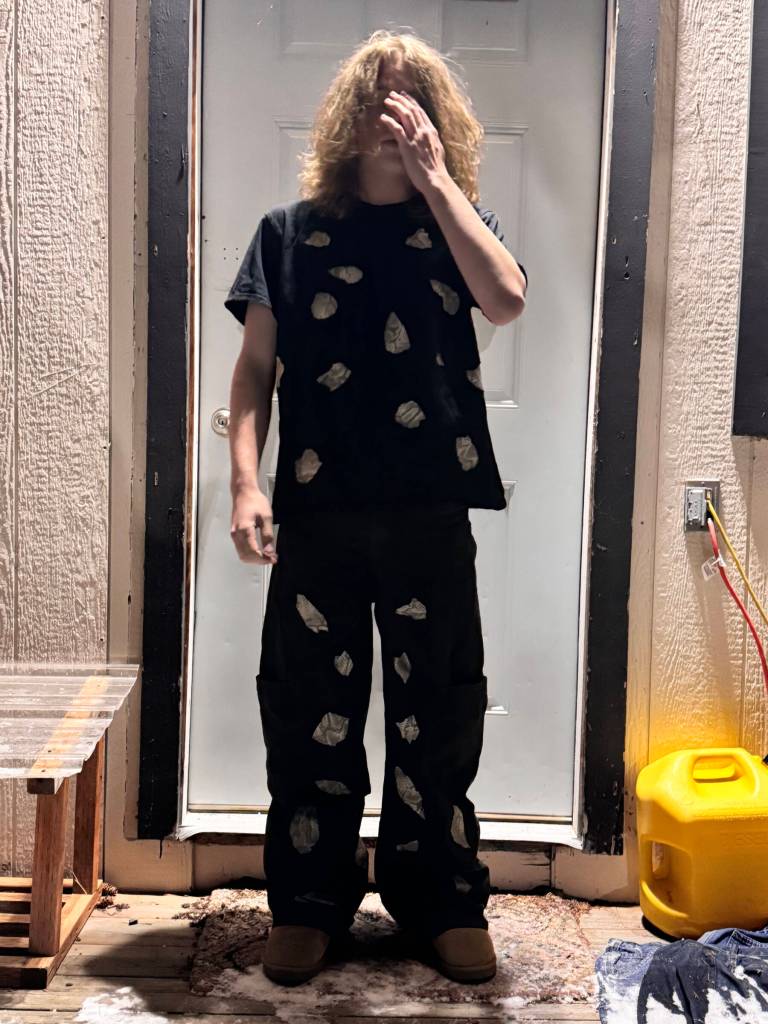 Homer youth David Sims wears a t-shirt and pair of jeans he bought at a thrift store and customized earlier this year by cutting holes in the fabric and patching them with snakeskin. Photo provided by David Sims