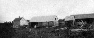 This U.S. Department of Agriculture photograph, from the 1903 report on Alaskan agricultural experiment stations, shows some of the buildings at the Kenai Station, including the superintendents main quarters, at far left.