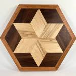 A hand-carved wooden star trivet by Ted Heuer is on display at Ptarmigan Arts through December during their Deck the Walls holiday show, featuring work by gallery members. Photo provided by Ptarmigan Arts