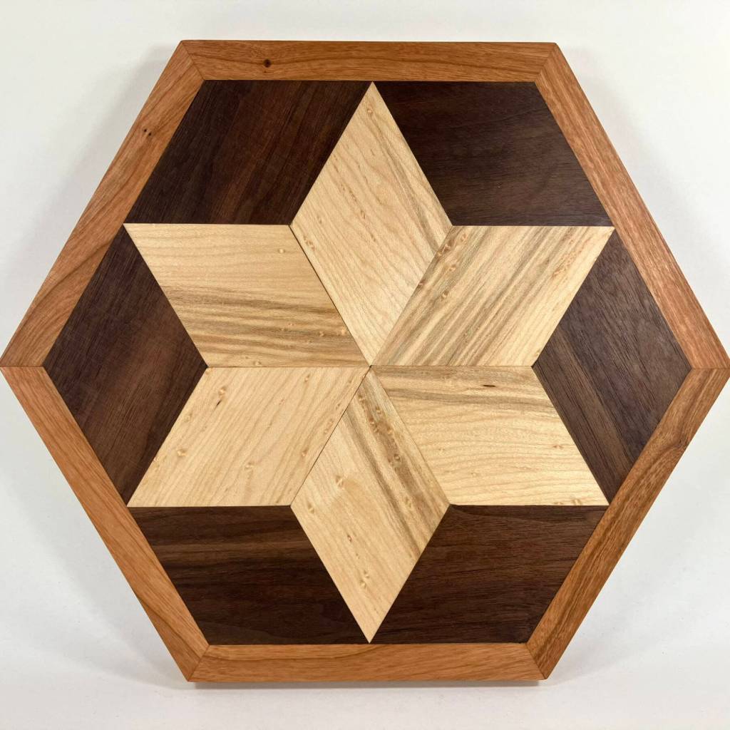 A hand-carved wooden star trivet by Ted Heuer is on display at Ptarmigan Arts through December during their Deck the Walls holiday show, featuring work by gallery members. Photo provided by Ptarmigan Arts