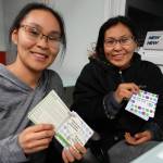 A parent and teen use conversation cards created by the Alaska Children's Trust. Photo courtesy Kaila Pfister