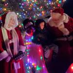 Santa and Mrs. Claus listen to childrens request for Christmas presents during the annual holiday tree lighting ceremony on Thursday, Dec. 4, 2025, at the Homer Chamber of Commerce in Homer, Alaska. (Delcenia Cosman/Homer News)