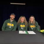 Photo courtesy of Sophie Tapley
Kenai Centrals Sophie Tapley (center) on Nov. 26<ins>,</ins><ins> 2025,</ins> commits to playing volleyball at the University of Alaska Anchorage during the 2026-2027 school year. Tapley was a varsity hitter for three years at Kenai Central.