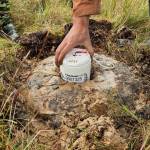 A seismic sensor rests in a “mud pie” on Kodiak Island in Alaska in September 2025. Photo by Cade Quigley