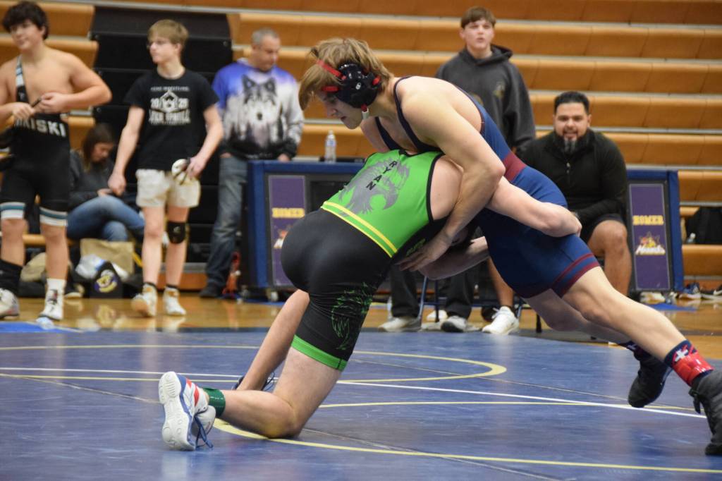 Sewards Atlin Ryan wrestles against a Mountain City Christian Academy athlete during the regional Kachemak Conference Wrestling Championships on Saturday, Dec. 13, 2025, at Homer High School in Homer, Alaska. (Delcenia Cosman/Homer News)