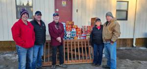 The Homer Elks Lodge #2127 completes their fourth food delivery to the Anchor Point Food Pantry for their Childrens Weekend Food Program on Dec. 12, 2025, in Anchor Point, Alaska. Pictured left to right are Homer Elks Lodge Leading Knight John Mink, Trustee Matthew Hockema, Trustee John Chapple III, Exalted Ruler Jill Hockema and APFP volunteer and local veteran Richard, no last name given. Photo provided by Jill Hockema