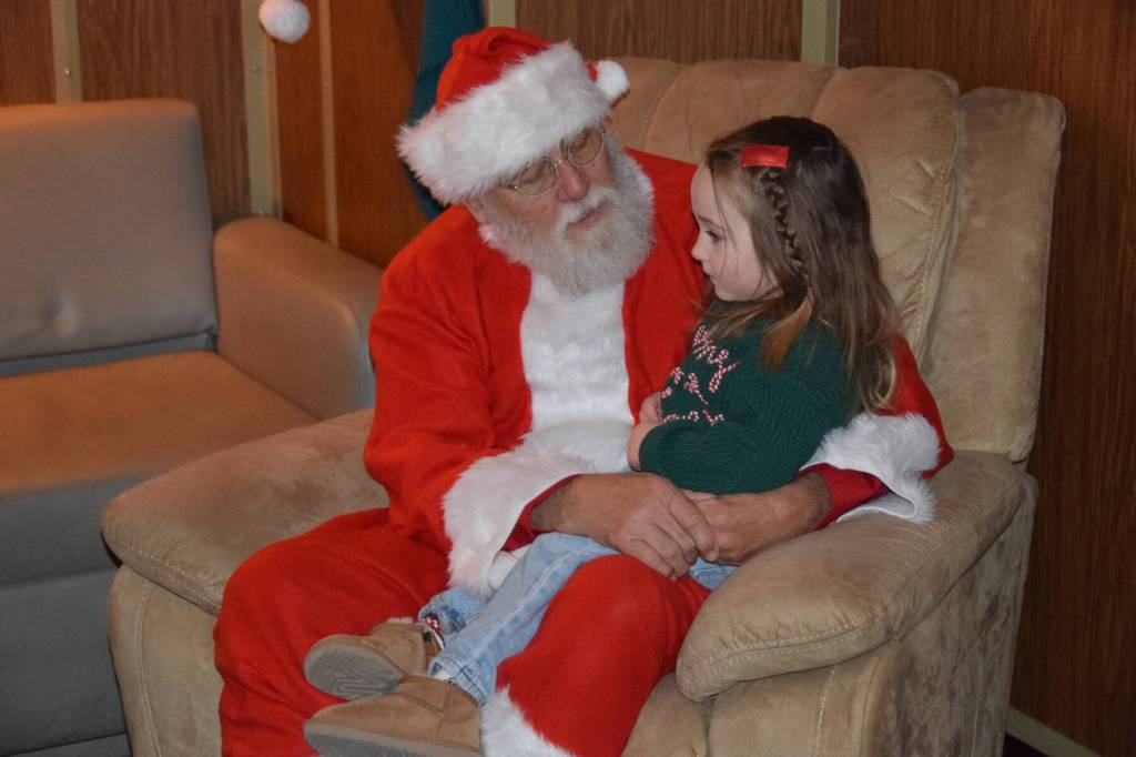 Kids visit with Santa aboard the USCGC Aspen during the inaugural Jolly Aspen holiday event and food drive on Thursday, Dec. 17, 2025, in Homer, Alaska. (Delcenia Cosman/Homer News)