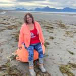 Homer artist June Denver participates in the Surfrider Kenai Peninsula chapter beach cleanup at the Mariner Park beach in July 2025 in Homer, Alaska. Photo provided by June Denver