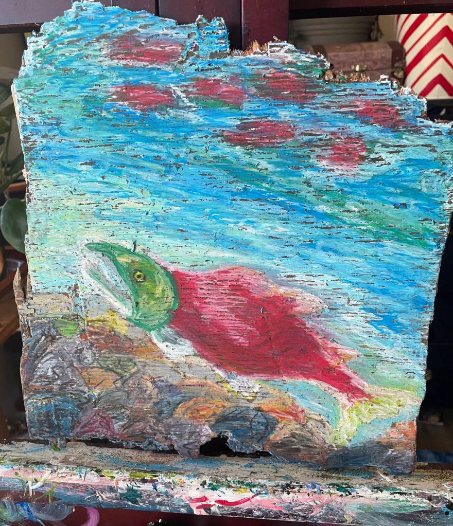 A Moment of Peace Below the Surface is an oil pastel piece on reclaimed driftwood by June Denver. Photo provided by June Denver