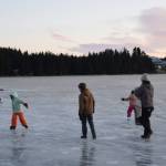 Families enjoy ice skating on Beluga Lake on Thursday, Dec. 18, 2025, in Homer, Alaska. (Delcenia Cosman/Homer News)