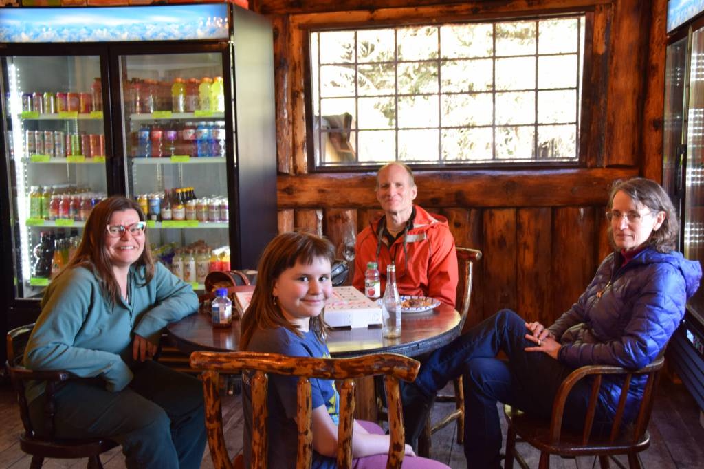 Happy customers pose for a photo in the Fritz Creek General Store on its reopening day on Thursday, April 24. (Chloe Pleznac/Homer News)