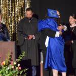 Chloe Pleznac/Homer News 
Graduating senior Rainey Sundheim hugs choral director Kyle Schneider as he presents her with her diploma during the 2025 Homer High School graduation ceremony on Wednesday, May 21 in the Alice Witte Gymnasium.