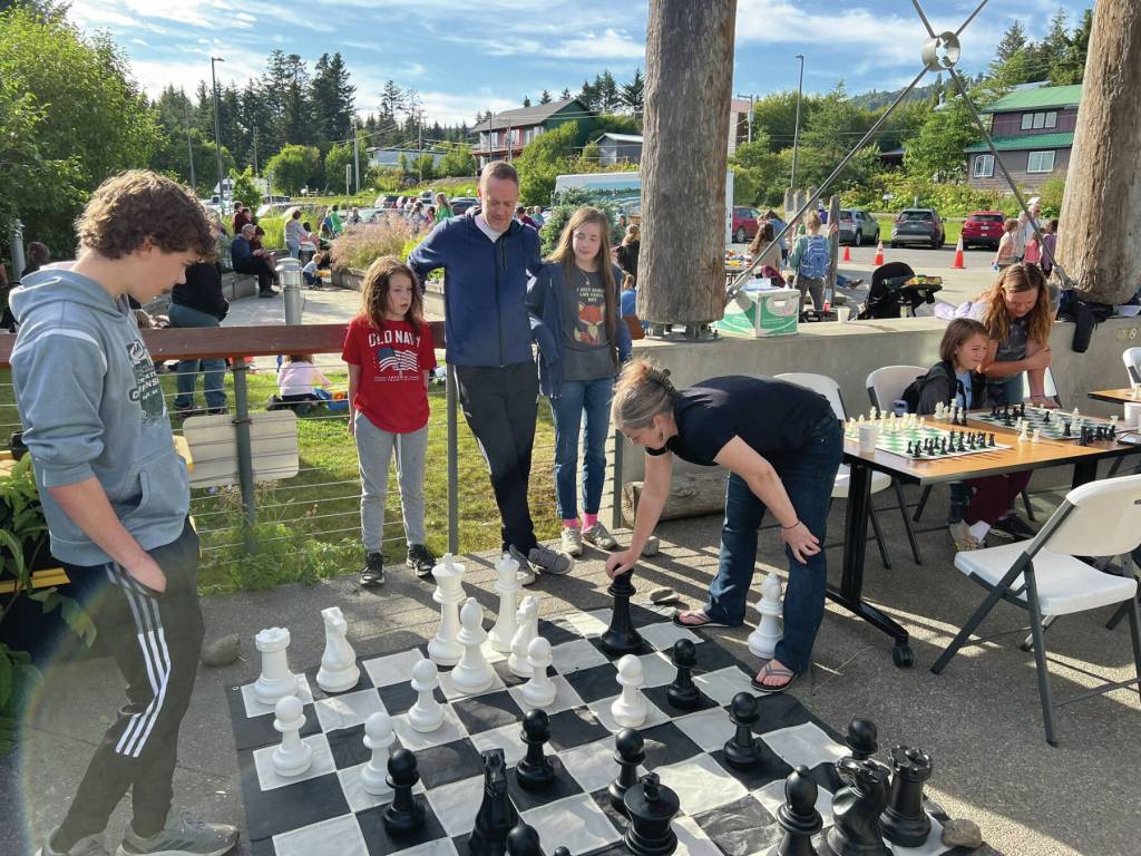 Photo courtesy of Cheryl Illg 
Attendees of the Homer Public Librarys End of Summer Reading Party enjoy playing games like giant chess on Saturday, July 26, 2025. The event also featured other games and activities, live music by the Shamwari Marimba Ensemble, and prizes, including for the winner of the Lego contest held during the summer reading program.