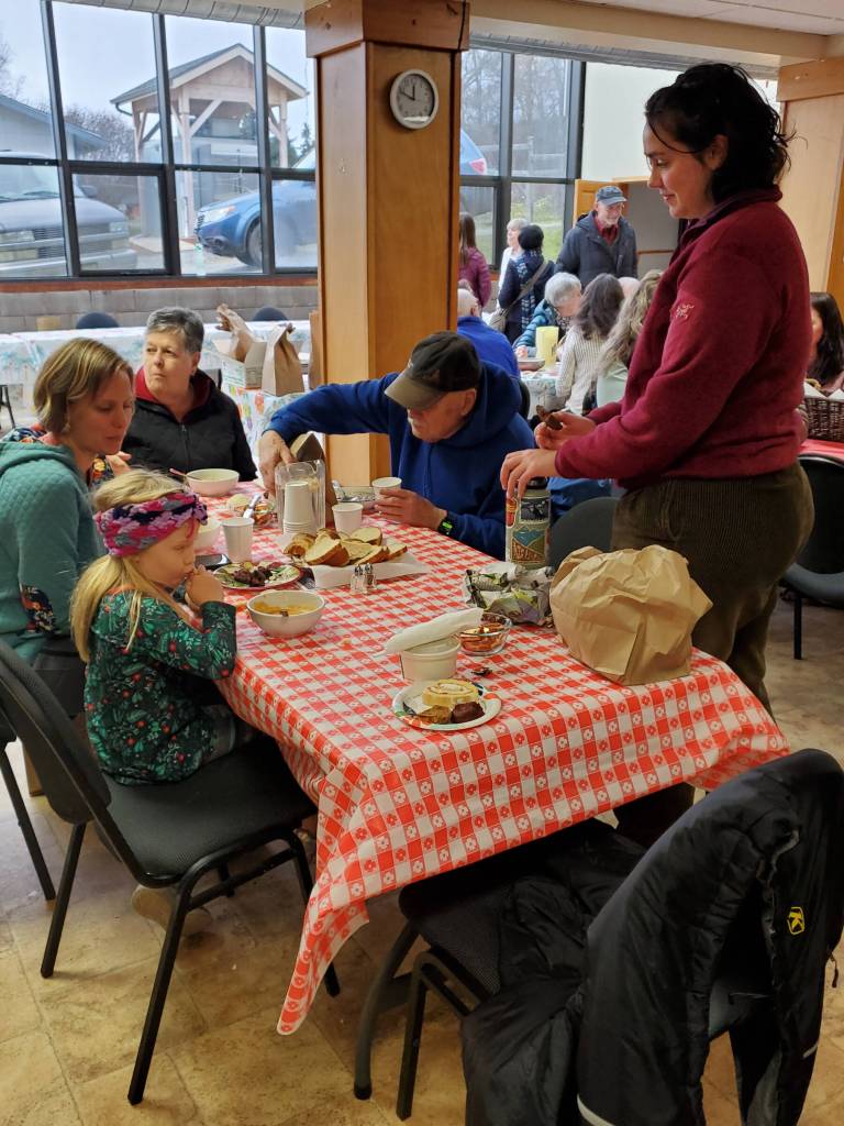 A family eats together at a table in the Homer United Methodist Church during the Homer Community Food Pantrys annual Empty Bowl fundraiser on Friday, Nov. 7, 2025<ins>,</ins><ins> in Homer, </ins><ins>Alaska</ins>. (Delcenia Cosman/Homer News)