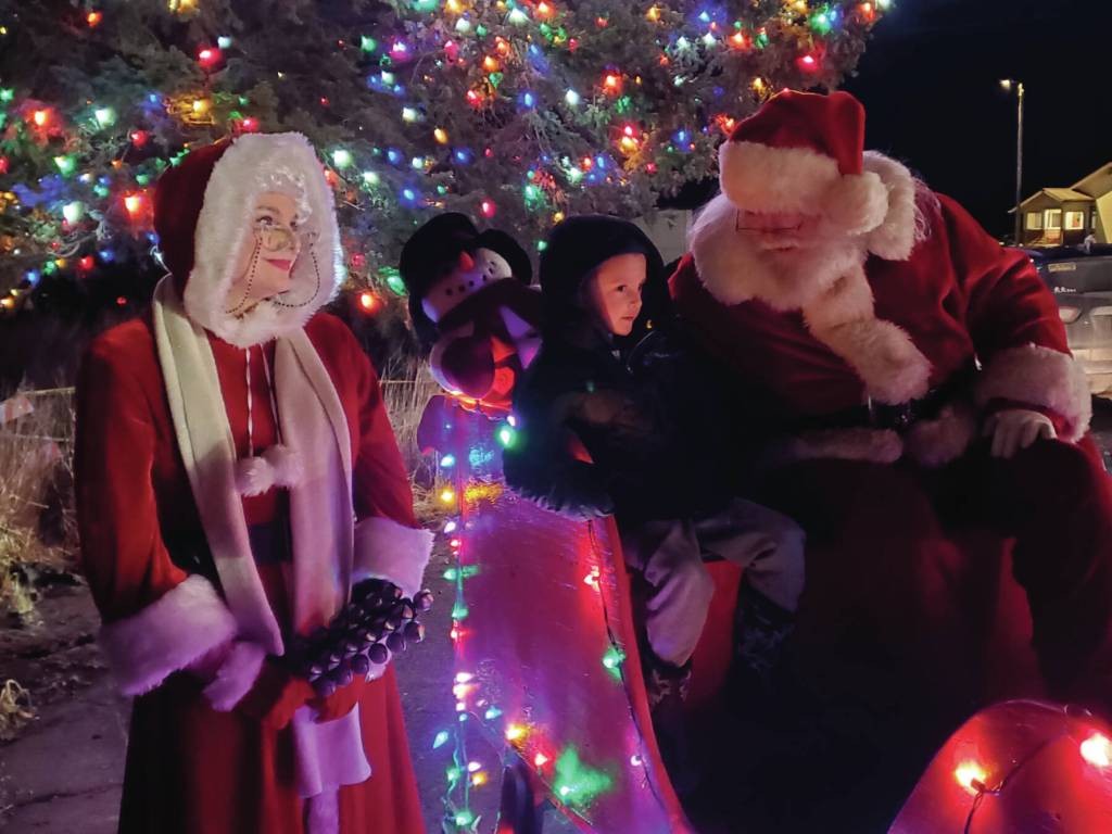 Delcenia Cosman/Homer News 
Santa and Mrs. Claus listen to childrens request for Christmas presents during the annual holiday tree lighting ceremony on Thursday, Dec. 4, 2025, at the Homer Chamber of Commerce<ins> in Homer, Alaska</ins>.