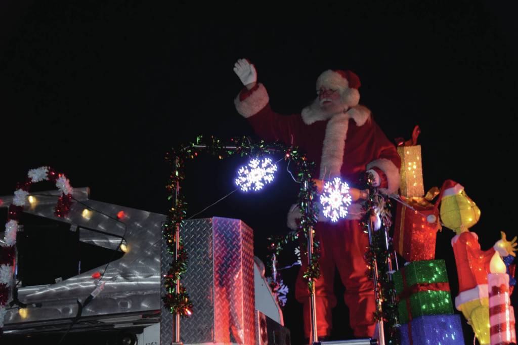 Santa arrives to the annual holiday tree lighting ceremony at the Homer Chamber of Commerce atop a Homer Volunteer Fire Department fire truck on Thursday, Dec. 4, 2025<ins>,</ins><ins> in Homer, </ins><ins>Alaska</ins>. (Delcenia Cosman/Homer News)