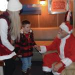 Kids visit with Santa aboard the USCGC Aspen during the inaugural Jolly Aspen holiday event and food drive on Thursday, Dec. 17, 2025<ins>,</ins><ins> in Homer, </ins><ins>Alaska</ins>. (Delcenia Cosman/Homer News)