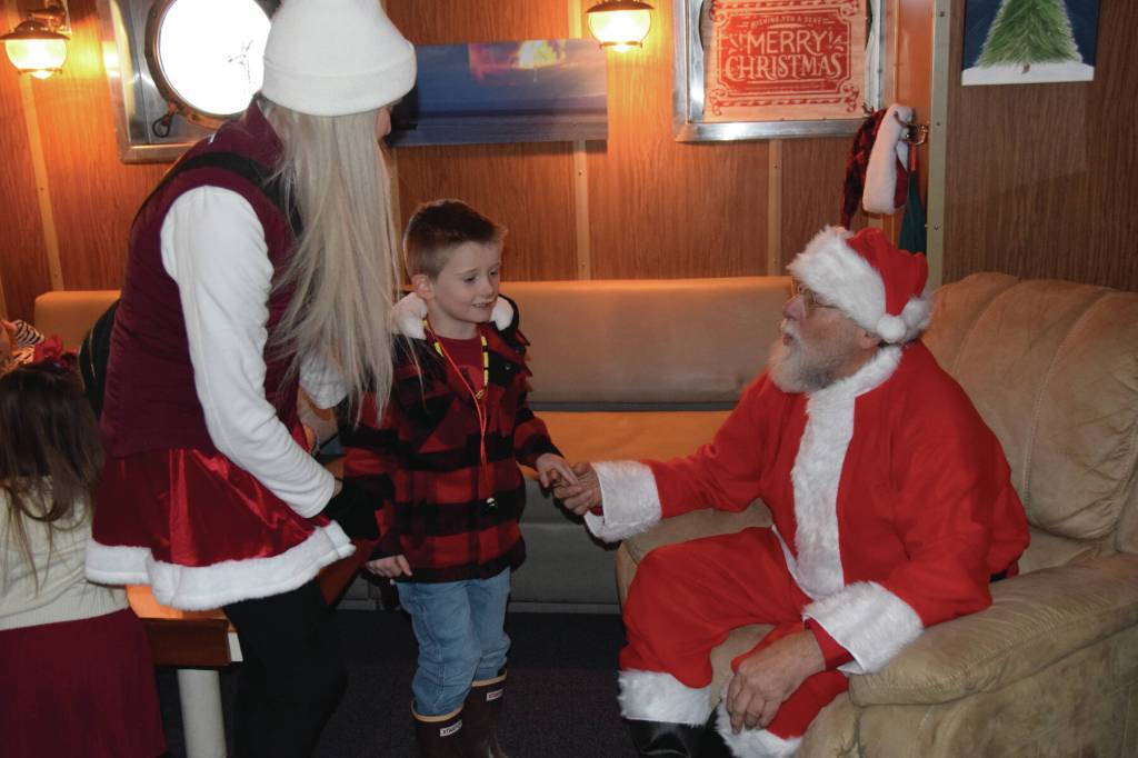Kids visit with Santa aboard the USCGC Aspen during the inaugural Jolly Aspen holiday event and food drive on Thursday, Dec. 17, 2025<ins>,</ins><ins> in Homer, </ins><ins>Alaska</ins>. (Delcenia Cosman/Homer News)
