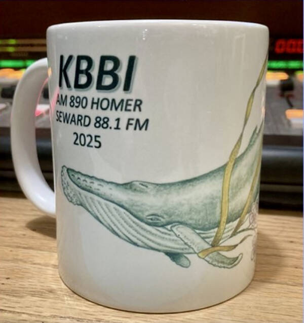 KBBIs 2025 coffee mug features a drawing created by Homer artist Conrad Field. Photo courtesy KBBI AM 890