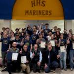 Members of the Homer High School boys and girls cross country teams pose for a photo with coaches and Kenai Peninsula Borough Mayor Peter Micciche following the borough's presentation of a commendation and certificates of achievement to the athletes on Wednesday, Jan. 14, 2026, in Homer, Alaska. Photo courtesy Justin Zank