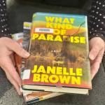 A Homer Public Library patron checks out a stack of books from this years Lit Lineup list. Photo by Christina Whiting