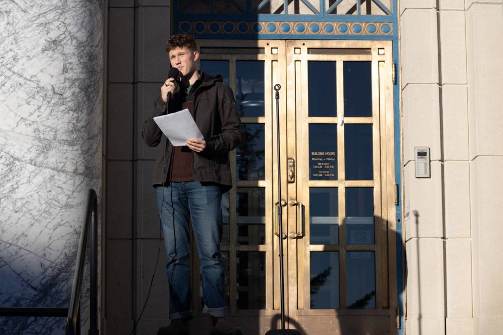 Atagan Hood, co-president of the Juneau-Douglas High School: Yadaa.at Kalé chapter of Alaska Youth for Environmental Action, speaks during a student-led protest on Jan. 24<ins>, 2026</ins>. Dozens of Juneauites gathered outside the Alaska State Capitol building to protest the LNG pipelines advancement.
