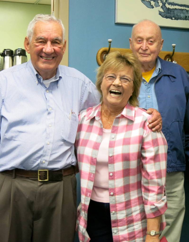 At the Elvey Building, home of UAFs Geophysical Institute, Carl Benson, far right, and Val Scullion of the GI business office attend a 2014 retirement party with Glenn Shaw. Photo by Ned Rozell