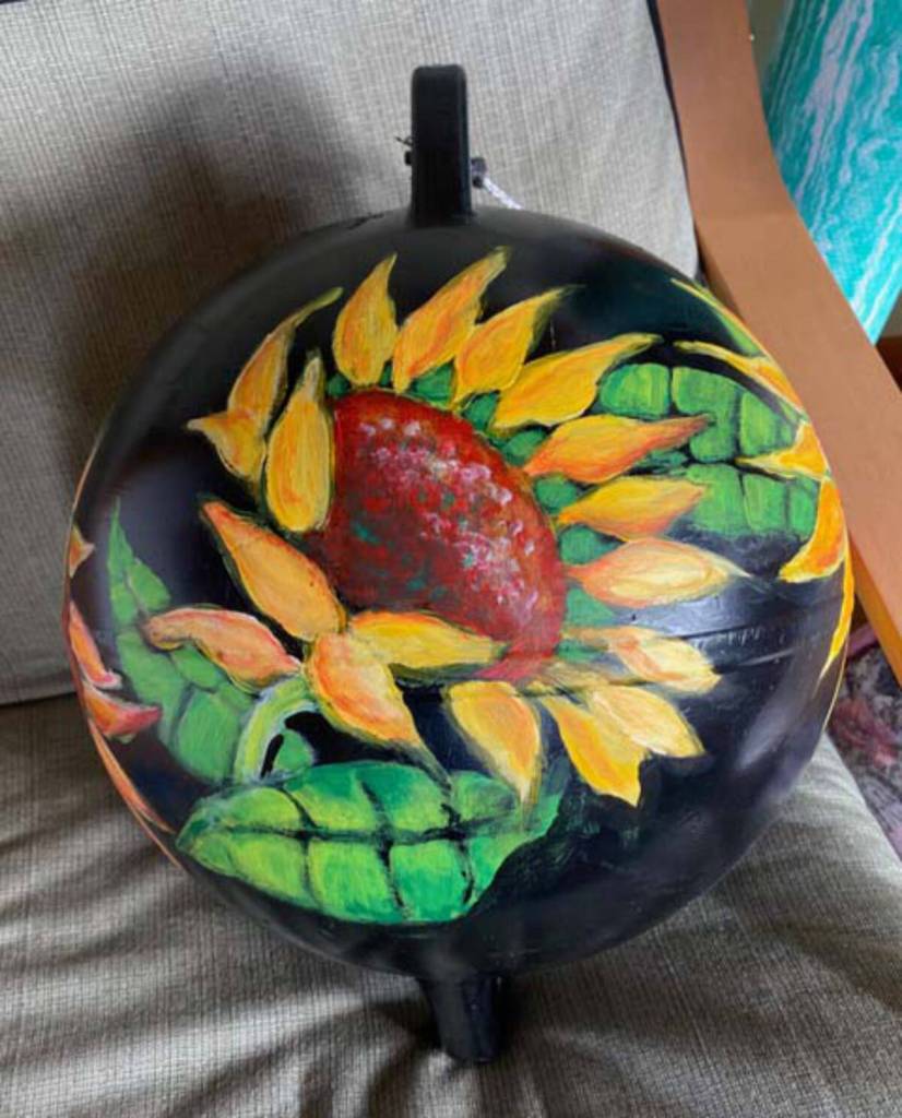 A painted buoy by Jan Peyton, a new member to the Ptarmigan Arts co-op gallery, depicts a sunflower in bloom. Photo provided by Ptarmigan Arts