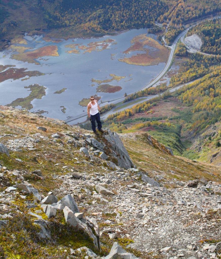 Hiker Mike Crawford poses high above Tern Lake in 2011. (Photo by Clark Fair)