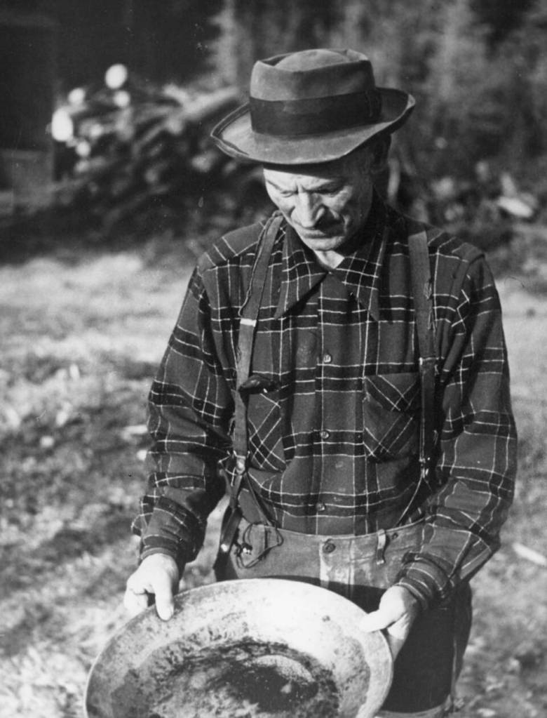 Frank Towle pans for gold on the Kenai Peninsula in the 1950s.