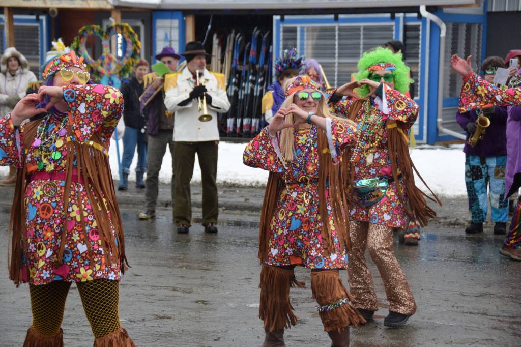 Members of the Krewe of Gambrinus dance in front of the judges station on Pioneer Avenue to the Beatles All You Need is Love during the Winter Carnival Parade on Saturday, Feb. 14, 2026, in Homer, Alaska. (Delcenia Cosman/Homer News)