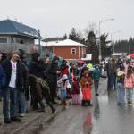 Community members gather along Pioneer Avenue for the 72nd annual Winter Carnival Parade on Saturday, Feb. 14, 2026, in Homer, Alaska. (Delcenia Cosman/Homer News)