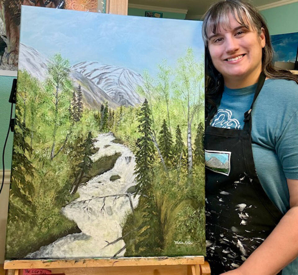 Theresa Ritter is photographed with her acrylic painting, Russian River Springtime in this undated photograph. Ritter is one of several artists showing work in Homer Council on the Arts annual Members Show, on display through February. Photo provided by Homer Council on the Arts