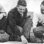 Photo from Naptowne: The Kids Story, by Carla Petrovich Rusk and Pete Petrovich
(from left to right) Indianapolis residents George Ray Stone and Alex and George Petrovich, circa 1947, study a map of the central Kenai Peninsula, where they plan to make their new home. They became some of the earliest homesteaders in what is now known as Sterling.