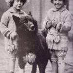 The Quackenbush twins of Seattle greet Balto in March 1925 after the dog and musher Gunner Kaasen arrived from Alaska. Photo from the Cleveland Press Collection, Cleveland State University.