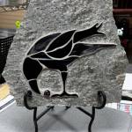 Raven with Berry is a glass mosaic on stone by Ptarmigan Arts member Carole Miller. Photo provided by Carole Miller