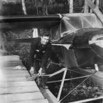 Don Culver, first Longmere Lake homesteader, poses with his airplane and dock in 1955.