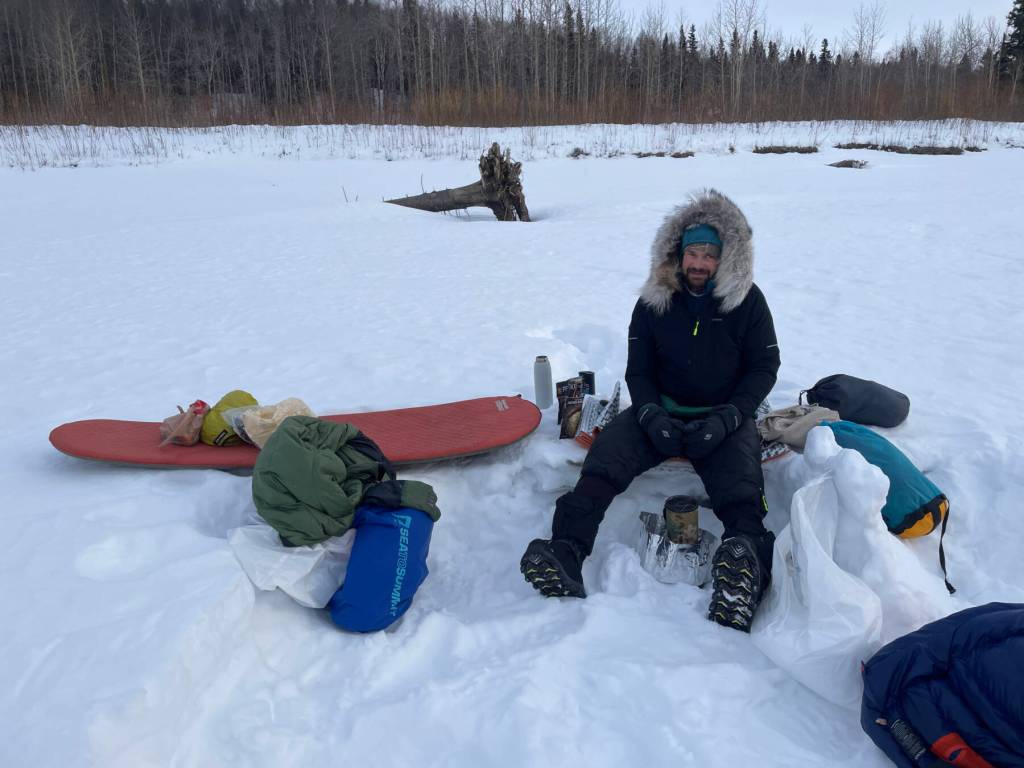 Forest Wagner melts snow to hydrate meals at a campsite on the Yukon River between the villages of Ruby and Tanana on April 2, 2026. Photo courtesy Ned Rozell
