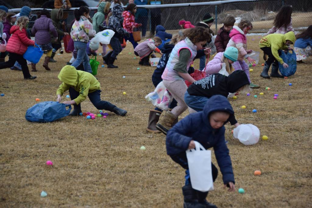 Kids in kindergarten and first grade race to pick up as many eggs as they can during the community Easter egg hunt sponsored by Church on the Rock Homer on Saturday, April 4, 2026, in Homer, Alaska. (Delcenia Cosman/Homer News)