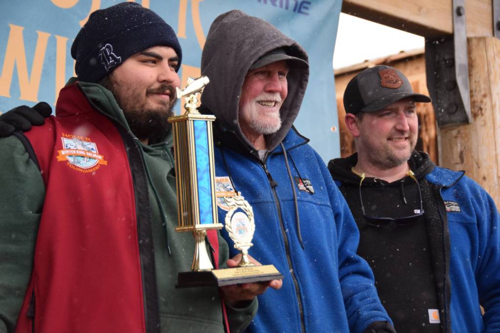 Michael Ardenia holds up his first place trophy during the 32nd annual Homer Winter King Tournament on Saturday, April 4, 2026, in Homer, Alaska. (Delcenia Cosman/Homer News)