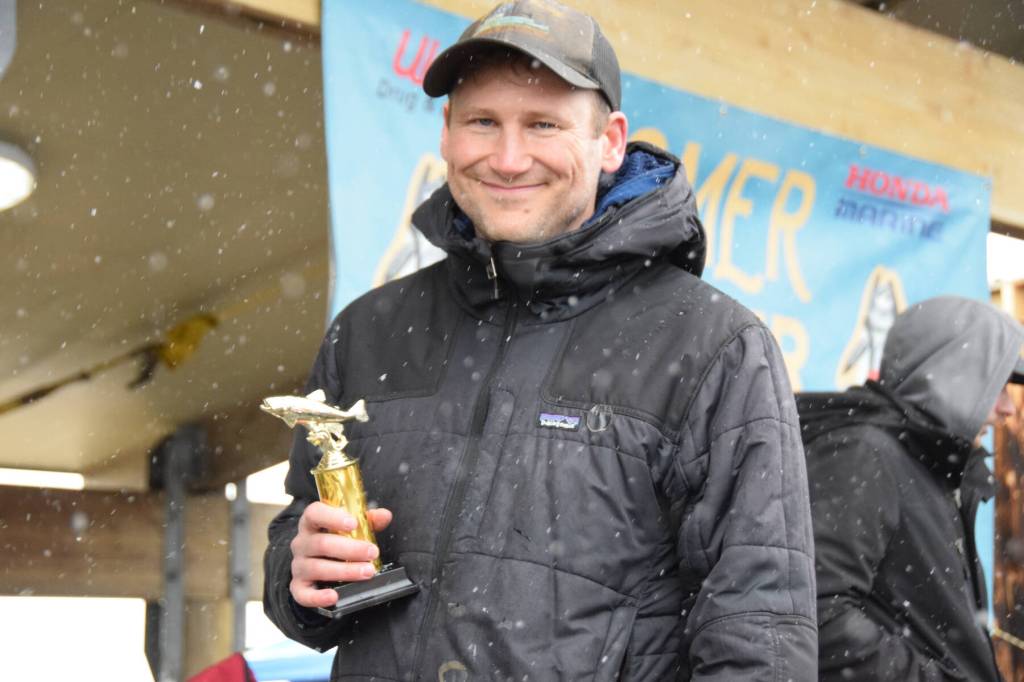 Bo Calhoun holds up his fifth place trophy during the 32nd annual Homer Winter King Tournament on Saturday, April 4, 2026, in Homer, Alaska. (Delcenia Cosman/Homer News)